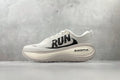 Nike Vomero Plus “Reverse Swoosh” Sneakers – White