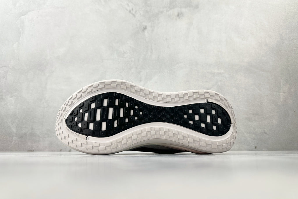 Nike Vomero Plus “Reverse Swoosh” Sneakers – White