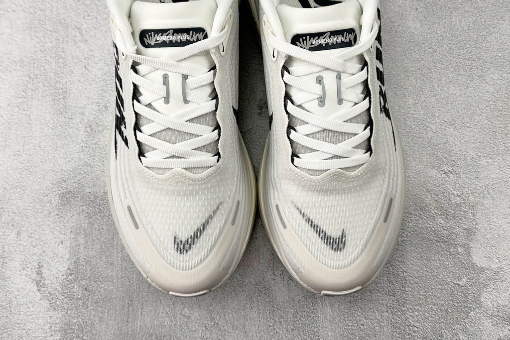 Nike Vomero Plus “Reverse Swoosh” Sneakers – White