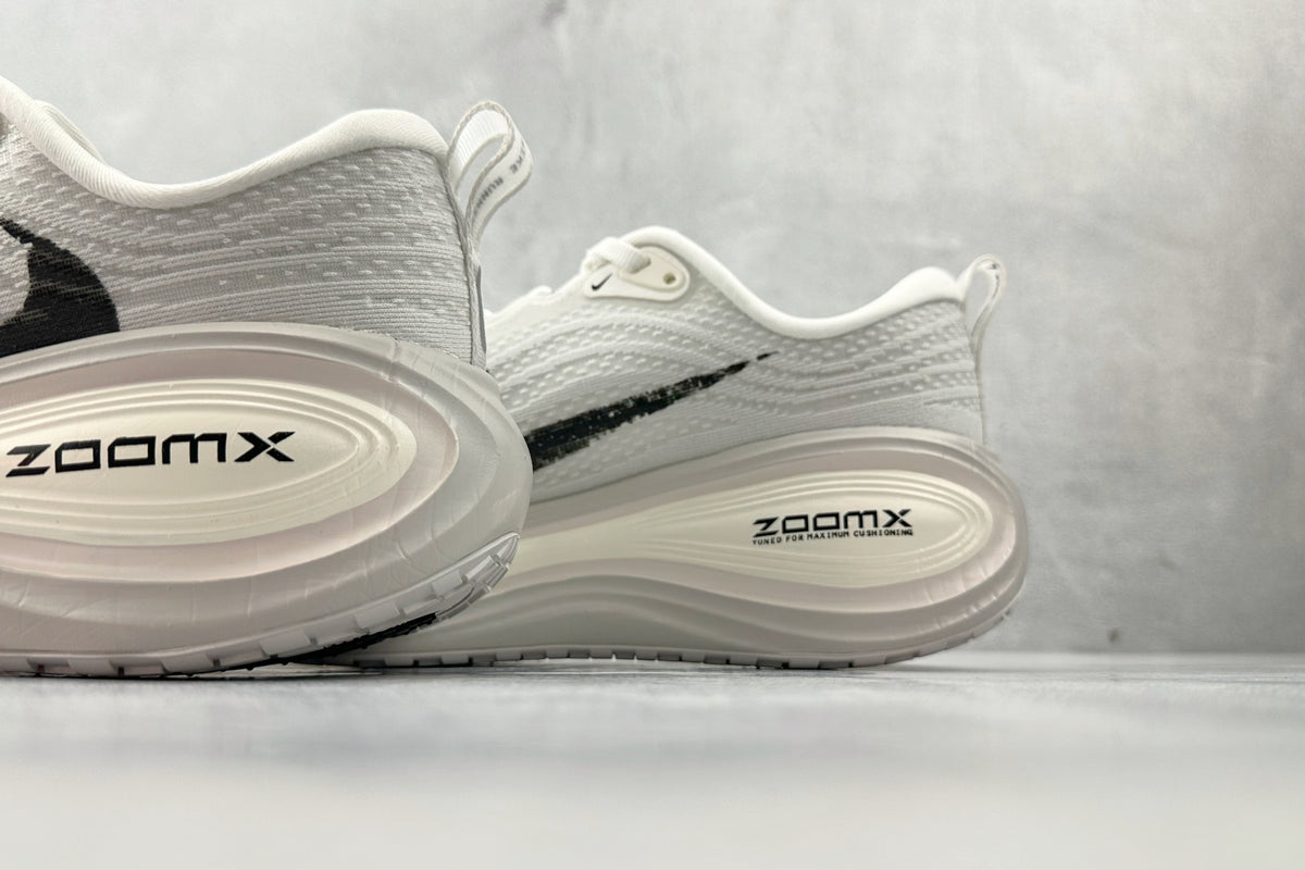 Nike Vomero Plus “Reverse Swoosh” Sneakers – White