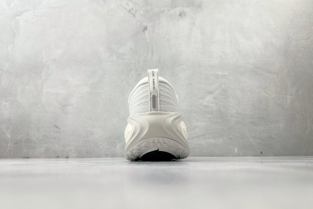Nike Vomero Plus “Reverse Swoosh” Sneakers – White