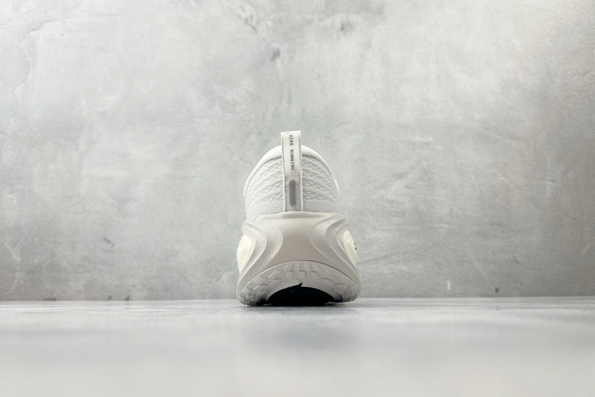 Nike Vomero Plus “Reverse Swoosh” Sneakers – White