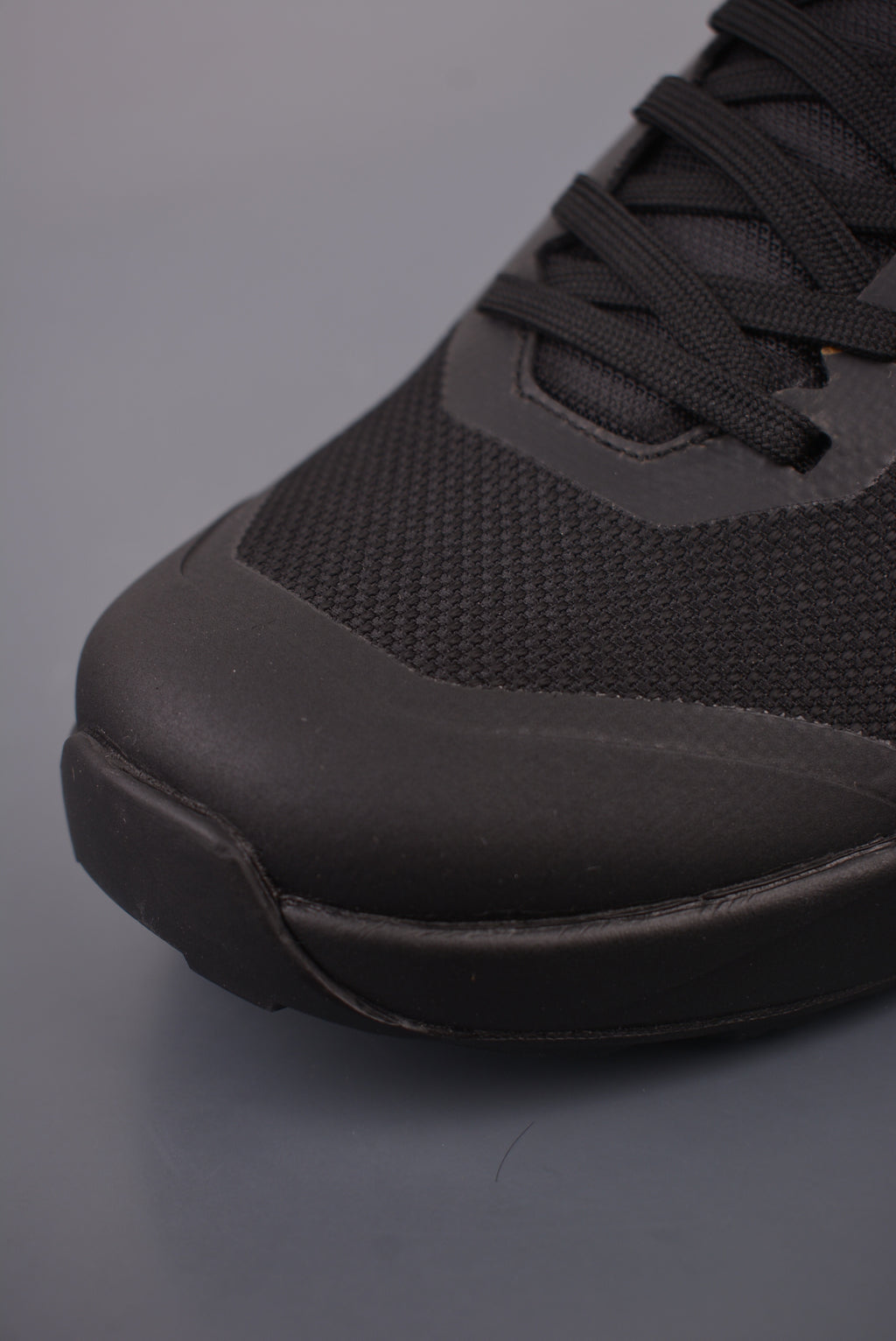 Arc’teryx Low-Top Lace-Up Shoes in Black with Gold Logo