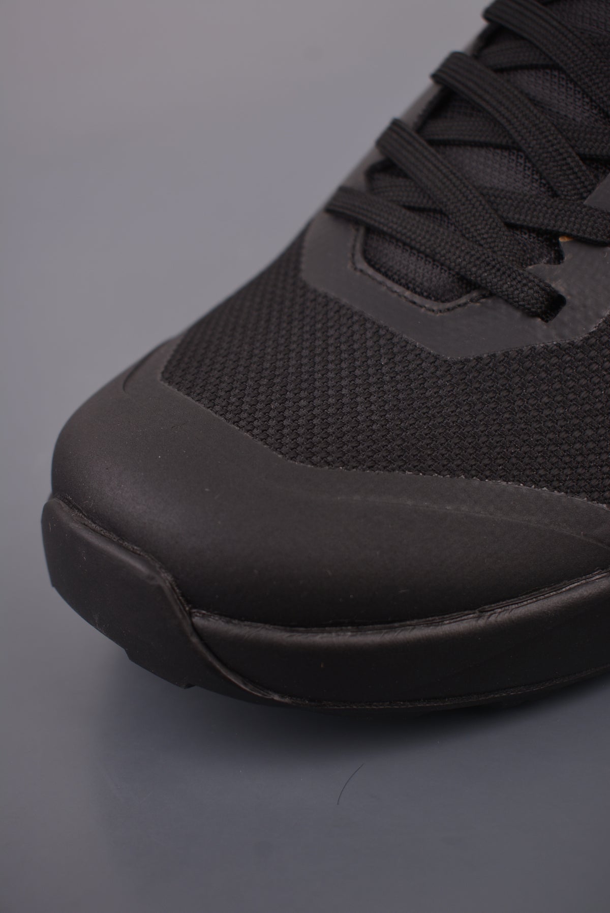 Arc’teryx Low-Top Lace-Up Shoes in Black with Gold Logo