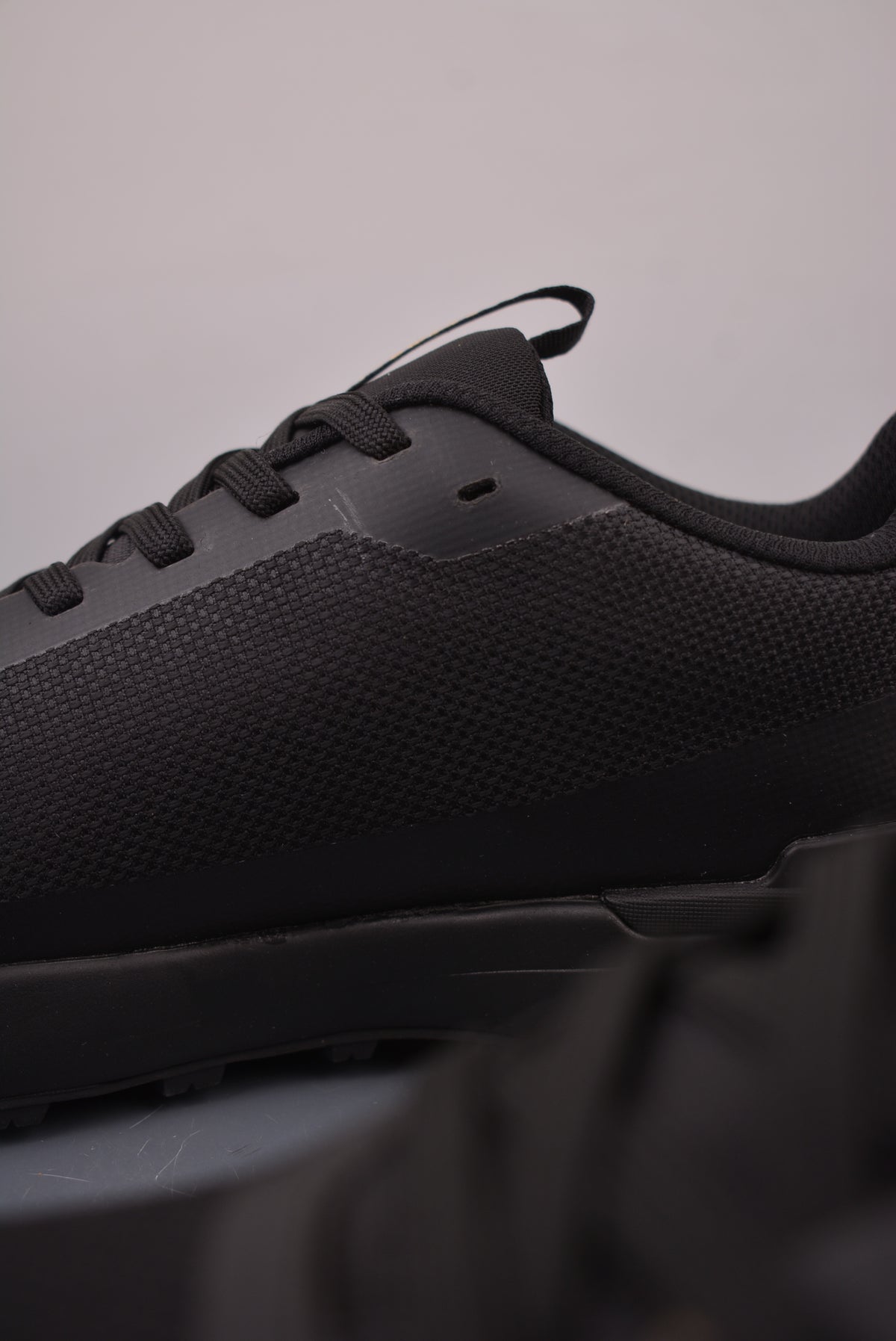 Arc’teryx Low-Top Lace-Up Shoes in Black with Gold Logo